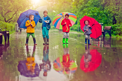 476139800-chilren-under-umbrella-gettyimages.jpg